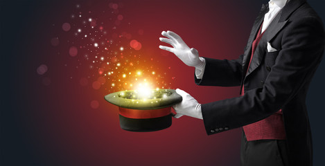 White glove hand conjuring something mysterious