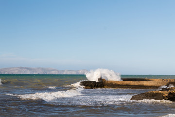 wave crushing on the heraklion city shore during a windy day