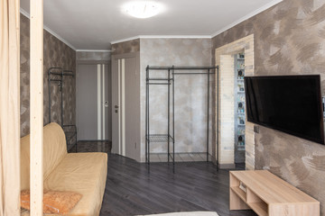 Interior of a small one-room apartment, view of the door