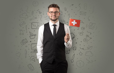 Businessman with office symbol concept and little flag on his hand
