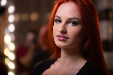 Fototapeta premium Portrait of woman with long red beautiful ginger hair.