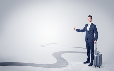 Obraz premium Young businessman hitchhiking with progressive arrow concept and copyspace 