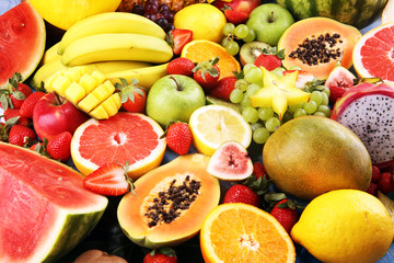 Tropical fruits background, many colorful ripe fresh tropical fruits