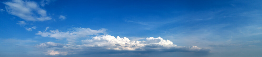 Sky panorama. Blue sky with tiny clouds.