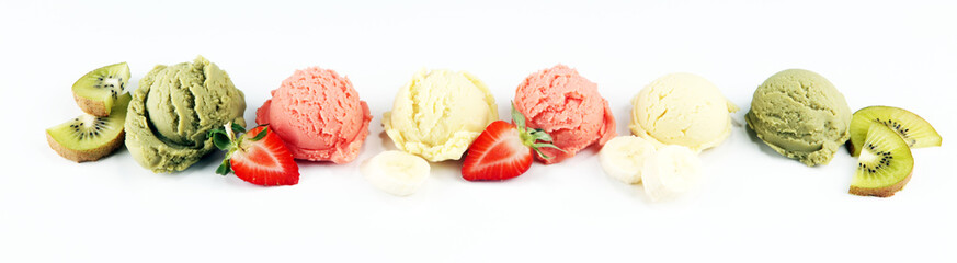 Set of ice cream scoops of different colors and flavours with berries and fruits