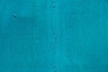 Imperfect metallic plate. Cracked paint close-up. Damage texture in macro. Grungy metal panel. Textured background. Rough faded uneven iron wall. Obsolete surface. Peeling of old paint. Flaking of dye