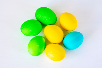 Easter eggs multicolored isolated on white background. Minimal easter concept. Happy easter card with copy space for text. Top view, flat.