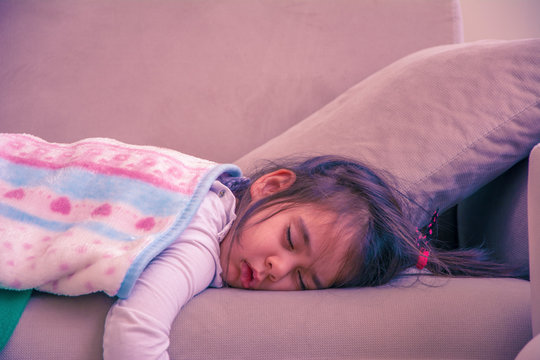 3 Year Old Little Girl Sleeping On Sofa