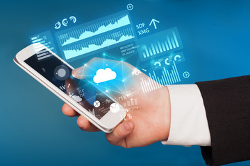 Hand using phone with cloud technology and linked information concept