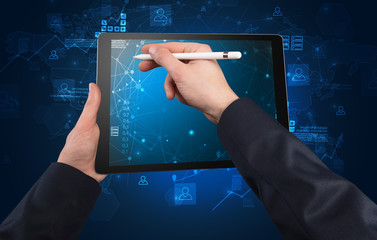 Elegant hand using tablet with online office kit concept
