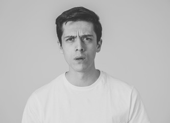 Human expressions and emotions. Young attractive man with a surprised face, eyes and mouth open.