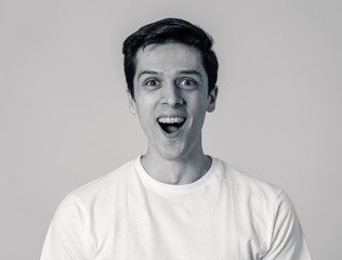 Portrait of surprised and happy man celebrating victory and winning lottery in human emotions