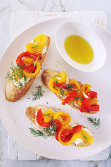Appetizer. Slice of bread, cream cheese and grilled bell pepper with olive oil