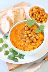  Carrot and hummus dip and bread, sesame and chick-pea dressing