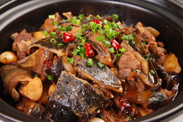 meat and vegetables in pan