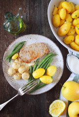 French cuisine: fried pork with Norman apple sauce, green beans and fried potatoes