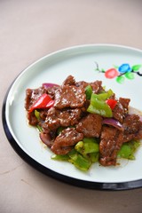 pork with rice and vegetables on white plate
