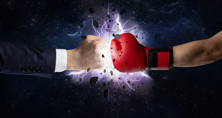 Obraz na płótnie Canvas Two hands fighting with storm explosion concept 