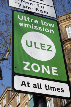 ULEZ, London, UK - April 8 2019: ULEZ (Ultra low emission zone) charge congestion charge & Ultra Low Emission Zone (ULEZ) warning sign central London £12.50, TFL - 15 minute city concern