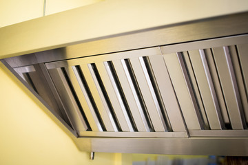 Exhaust systems, hood filters detail in a professional kitchen.