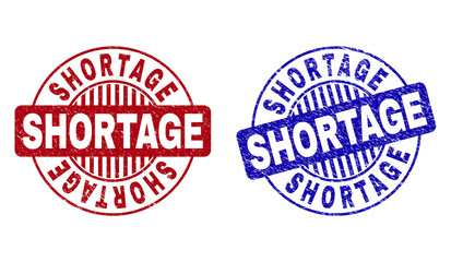 Grunge SHORTAGE round stamp seals isolated on a white background. Round seals with distress texture in red and blue colors. Vector rubber imitation of SHORTAGE text inside circle form with stripes.