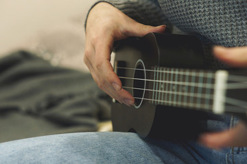 Young girl playing guitar music solo instrumental