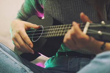 Young girl playing guitar music solo instrumental