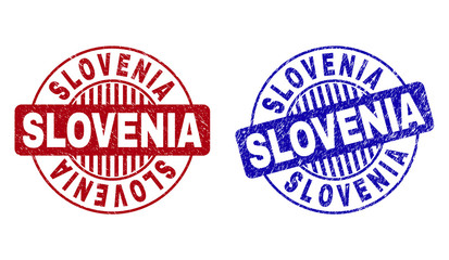 Grunge SLOVENIA round stamp seals isolated on a white background. Round seals with grunge texture in red and blue colors. Vector rubber overlay of SLOVENIA tag inside circle form with stripes.