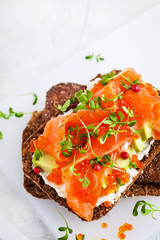 Salted salmon, red caviar, avocado and cream cheese rye crisp toast