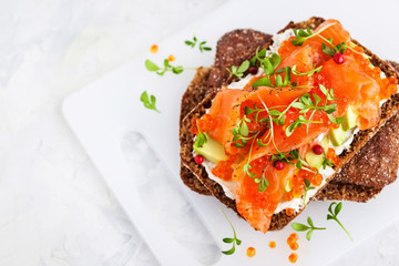 Salted salmon, red caviar, avocado and cream cheese rye crisp toast