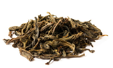 Dry tea leaves on the white