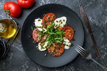 Caprese salad with mozzarella and tomato