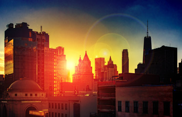 New York City dramatic sunlight shines on the skyscrapers of the Manhattan skyline