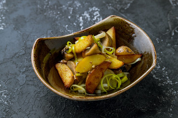 Fried potatoes with mushrooms