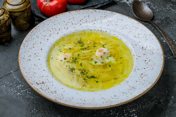 Chicken soup bouillon in a plate