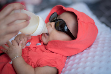 Children drink milk from bottles