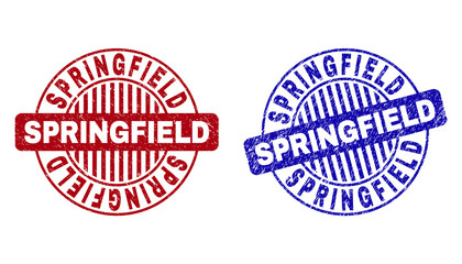 Grunge SPRINGFIELD round stamp seals isolated on a white background. Round seals with grunge texture in red and blue colors. Vector rubber watermark of SPRINGFIELD tag inside circle form with stripes.