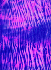 Abstract hand painted blue pink fabric background with irregular stripes