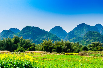 Fototapeta na wymiar Countryside and mountain scenery with blue sky background 