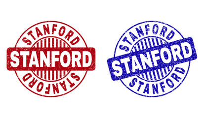 Grunge STANFORD round stamp seals isolated on a white background. Round seals with grunge texture in red and blue colors. Vector rubber imitation of STANFORD text inside circle form with stripes.