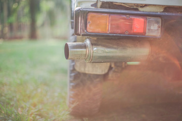 Close-up background view of car exhausts, adapted for use, blurred by sunlight and use, used in agriculture or in rubber plantations, oil palm