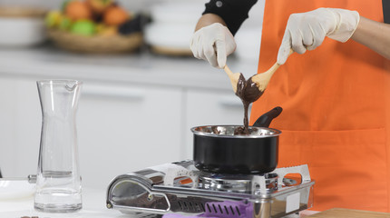 Woman making chocolate