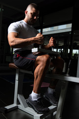Fototapeta na wymiar Muscular Man Working Out Calves