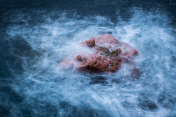 rock in the sea at Freycinet, dawn