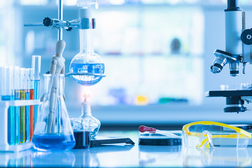 Colorful test tubes in wooden stand..