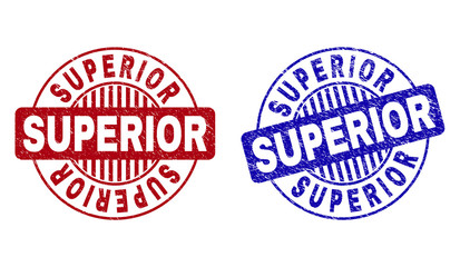 Grunge SUPERIOR round stamp seals isolated on a white background. Round seals with grunge texture in red and blue colors. Vector rubber overlay of SUPERIOR tag inside circle form with stripes.