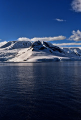 Fototapeta na wymiar Antarctic ice covered mountains and terrains 