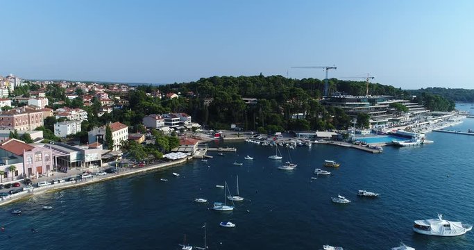 Aerial Drone Shot of an old Village next to the Sea with small Boats, 4k UHD