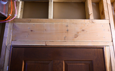 Stud-framed wall with double header