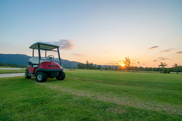 The golf course landscape with beautiful sky. Golf cart at the green golf course